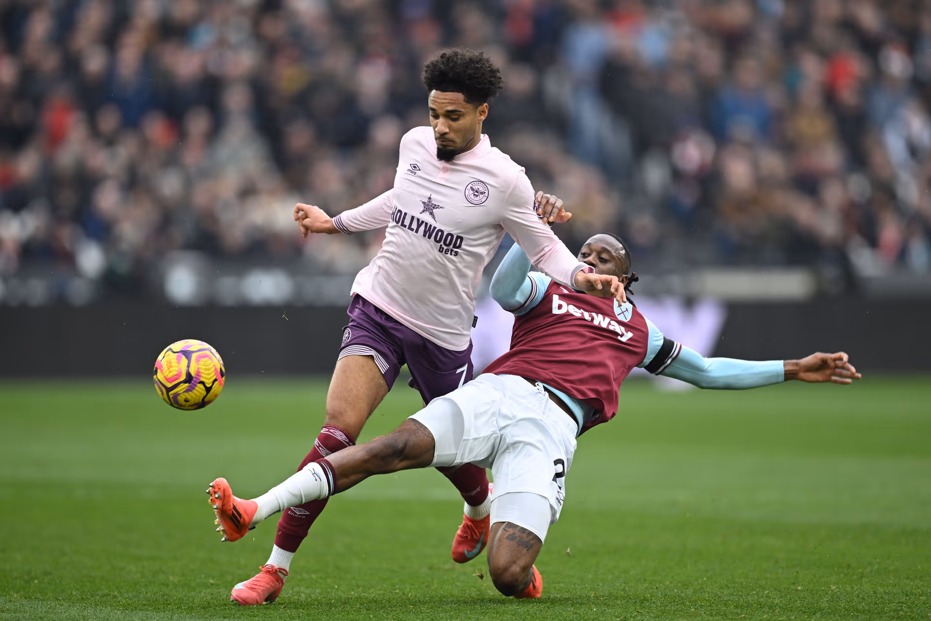 Aaron_Wan_Bissaka_of_West_Ham_United_is_battles_for_possession_with_Kevin_Schade_of_Brentford_30bba66151